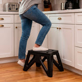 AKTIVE Taburete Plegable Multiusos Portátil con Diseño Antideslizante y Estructura Resistente para Hogar, Cocina y Camping, Soporta Hasta 150kg, 39 x 27 x 23 cm, Negro