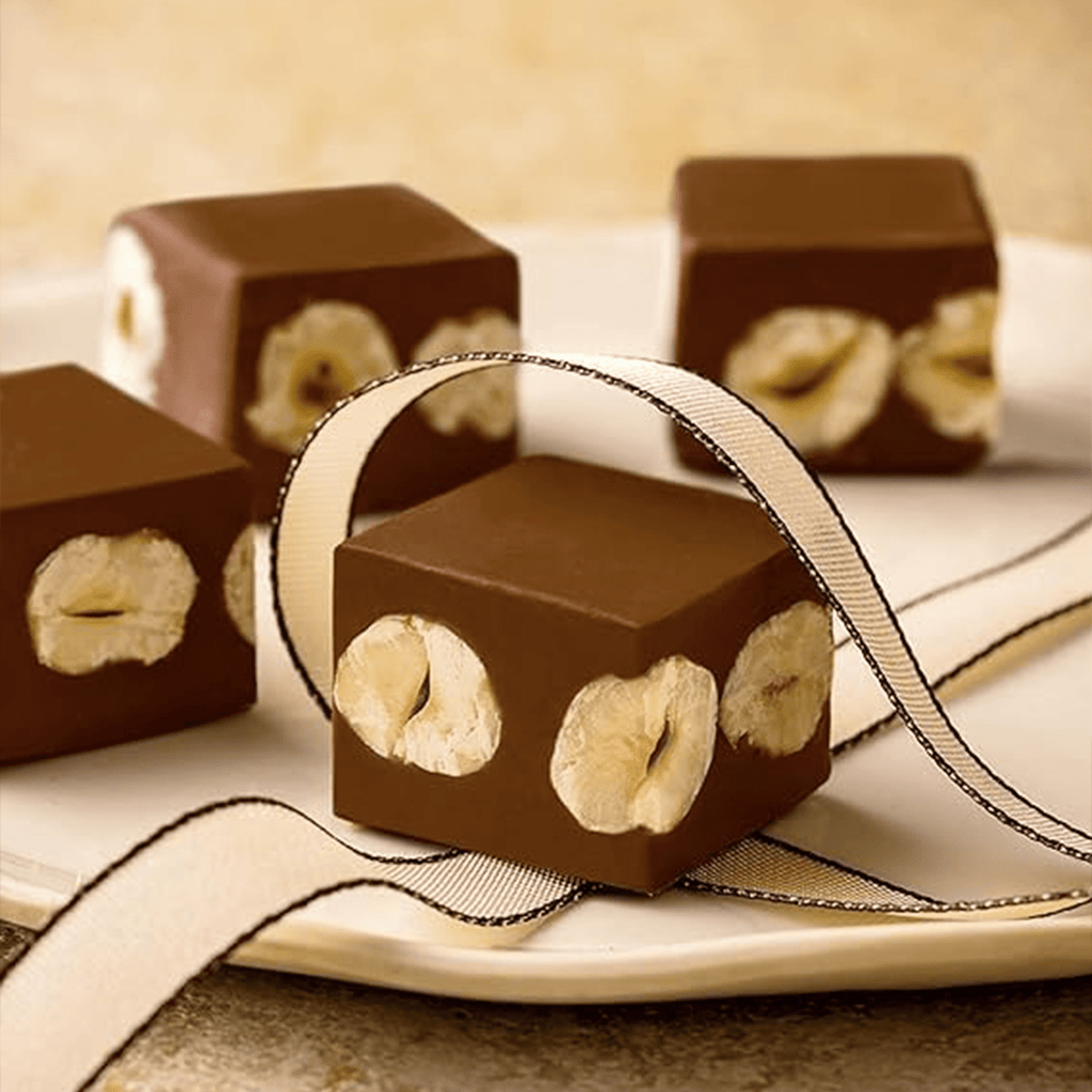 Lindt Nuxor Bombones de Chocolate con Leche y Avellanas, Chocolate Lindt, Chocolate con Frutos Secos, Cremoso, Crujiente, Bombones para Regalar, 150 g