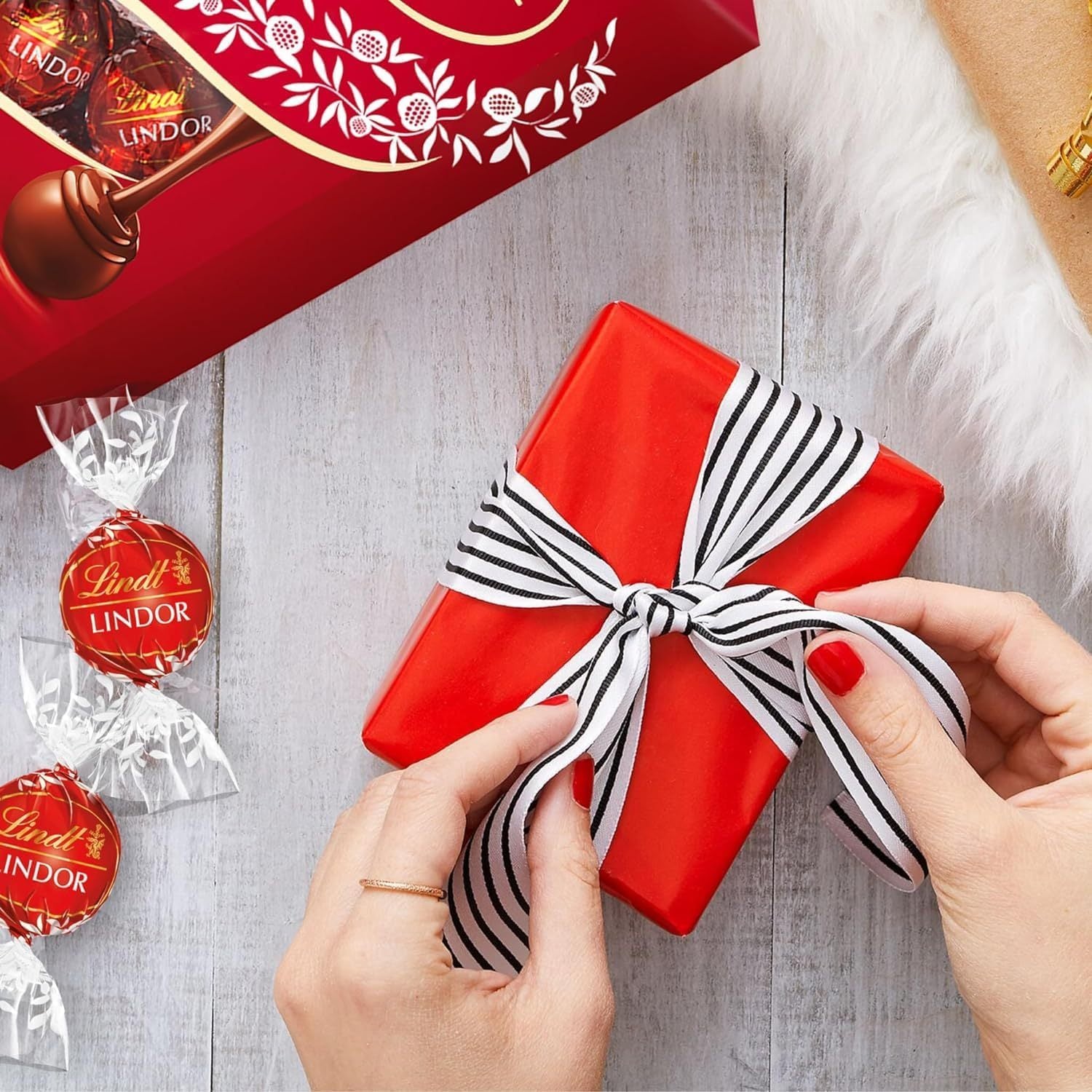 Lindt LINDOR Bombones de Chocolate con Leche, Bombón con Interior de Chocolate Cremoso, Bombones para Regalar, 200 g